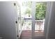 View from balcony shows the backyard, fence and a two-story home at 1156 Spruce St, Indianapolis, IN 46203