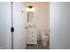 Cozy bathroom with black and white patterned tile flooring, updated vanity and mirror at 1156 Spruce St, Indianapolis, IN 46203