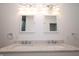 Double sink vanity with marble countertops and modern lighting fixtures at 1156 Spruce St, Indianapolis, IN 46203