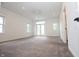 Spacious bedroom with carpet, ceiling fan, recessed lights and french doors to the balcony at 1156 Spruce St, Indianapolis, IN 46203