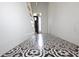 Bright foyer with a decorative tile floor and a view of the staircase and front door at 1156 Spruce St, Indianapolis, IN 46203