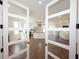 Bright, open kitchen features white cabinetry, stainless appliances, wood counters, and opens to a living space at 1156 Spruce St, Indianapolis, IN 46203