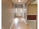 Bright entryway showcasing neutral paint, wood flooring, a white front door and foyer with natural lighting at 11754 Hamble Dr, Indianapolis, IN 46235
