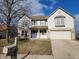 Charming two-story home featuring vinyl siding, blue shutters, a driveway, and an attached two-car garage at 11754 Hamble Dr, Indianapolis, IN 46235