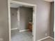 Hallway view showcasing a half-bathroom with a vanity and linoleum floors through the doorway at 11754 Hamble Dr, Indianapolis, IN 46235