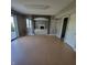 Spacious living room with hard wood floors, ample natural light, and an opening with pillars leading to Gathering room at 11754 Hamble Dr, Indianapolis, IN 46235