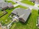 An aerial view of a home highlights a large, well-maintained yard, mature landscaping, and a peaceful backyard patio at 120 Wagon Trail, Mooresville, IN 46158