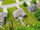 An aerial view showing a home with a manicured lawn, mature trees, and well-maintained landscaping, providing a serene setting at 120 Wagon Trail, Mooresville, IN 46158