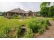 Large, well-maintained backyard with an expansive lawn and established landscaping at 120 Wagon Trail, Mooresville, IN 46158