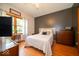 Bedroom with hardwood floors, natural light, and neutral decor at 120 Wagon Trail, Mooresville, IN 46158