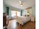 Serene bedroom featuring a comfortable bed, wood floors, and natural lighting at 120 Wagon Trail, Mooresville, IN 46158