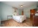 Charming bedroom with hardwood floors, a cozy bed, and ample natural light at 120 Wagon Trail, Mooresville, IN 46158