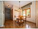 Inviting dining area with a round table, wood floors, and natural light at 120 Wagon Trail, Mooresville, IN 46158