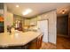 Charming kitchen with white cabinets, modern appliances, and a breakfast bar at 120 Wagon Trail, Mooresville, IN 46158