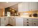Bright kitchen featuring sleek countertops, white cabinets, and modern appliances at 120 Wagon Trail, Mooresville, IN 46158