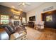 Warm and inviting living room with a fireplace and hardwood floors at 120 Wagon Trail, Mooresville, IN 46158