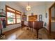 Living room with hardwood floors, piano, and natural light at 120 Wagon Trail, Mooresville, IN 46158