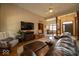 Spacious living room with wood floors, comfortable seating and an entertainment center at 120 Wagon Trail, Mooresville, IN 46158