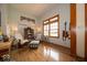 Cozy living room with hardwood floors, large window, and natural light at 120 Wagon Trail, Mooresville, IN 46158