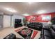 Finished basement featuring a comfortable seating area and a large Ohio State rug at 12093 Ashland Dr, Fishers, IN 46037