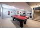 Finished basement featuring a pool table, exercise equipment, and neutral carpet at 12093 Ashland Dr, Fishers, IN 46037