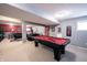 Large finished basement with pool table, media area, and Ohio State decor at 12093 Ashland Dr, Fishers, IN 46037