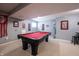 Basement game room with a red felt pool table and Ohio State decor at 12093 Ashland Dr, Fishers, IN 46037