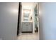Well-lit bathroom with tiled floors and classic gray vanity at 12093 Ashland Dr, Fishers, IN 46037
