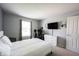 Well-lit bedroom with comfortable furnishings and modern electronics at 12093 Ashland Dr, Fishers, IN 46037