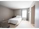 Well-lit bedroom with neutral walls, carpet, and a double bed at 12093 Ashland Dr, Fishers, IN 46037
