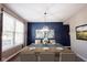 Elegant dining room featuring a wooden table, stylish chairs, and designer lighting, perfect for hosting gatherings and special occasions at 12093 Ashland Dr, Fishers, IN 46037