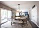 Bright dining area with a table, bench seating, and a view into the cozy living room space at 12093 Ashland Dr, Fishers, IN 46037