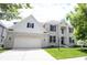 Charming two-story home featuring a brick facade, attached garage, and a well-manicured lawn, offering classic curb appeal at 12093 Ashland Dr, Fishers, IN 46037