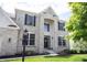 Inviting front entrance with a brick facade, well-lit doorway, and manicured landscaping, creating an inviting and elegant approach at 12093 Ashland Dr, Fishers, IN 46037