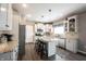 Bright kitchen with granite countertops, stainless steel appliances, and white cabinetry at 12093 Ashland Dr, Fishers, IN 46037