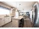 Bright kitchen with granite countertops, stainless steel appliances, and view to the living area at 12093 Ashland Dr, Fishers, IN 46037