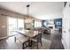 Open-concept dining area with a table for six, leading into a comfortable living room with a fireplace at 12093 Ashland Dr, Fishers, IN 46037