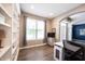 Cozy home office space with built-in shelving, ample natural light, and contemporary finishes, perfect for remote work or study at 12093 Ashland Dr, Fishers, IN 46037