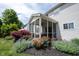Exterior view of screened in porch with mulched flower beds and beautiful landscaping at 12093 Ashland Dr, Fishers, IN 46037
