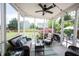 Relaxing screened porch with comfortable wicker furniture and outdoor views at 12093 Ashland Dr, Fishers, IN 46037
