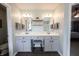 Bright vanity space with double sinks, a makeup area, and an entry into the main bedroom at 12093 Ashland Dr, Fishers, IN 46037