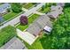 Aerial view of a home showcasing its well-maintained roof, patio, and lush green lawn at 1219 Driftwood Dr, Carmel, IN 46033