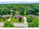 Aerial view of a suburban home showcasing mature trees, landscaped yards, and neighborhood streets at 1219 Driftwood Dr, Carmel, IN 46033
