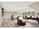 Spacious carpeted basement featuring sports memorabilia and gym equipment perfect for fitness and relaxation at 1219 Driftwood Dr, Carmel, IN 46033