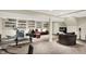 Finished basement showcasing sports memorabilia, neutral colors, and carpeted flooring with a full workout area at 1219 Driftwood Dr, Carmel, IN 46033