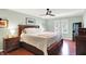 Main bedroom with hardwood floors, ceiling fan, and natural light, creating a relaxing retreat at 1219 Driftwood Dr, Carmel, IN 46033