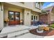 Inviting front entrance with double doors, a cozy seating area, and landscaped garden beds at 1219 Driftwood Dr, Carmel, IN 46033