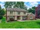 Charming two-story home with a brick facade, well-maintained lawn, and inviting front entrance at 1219 Driftwood Dr, Carmel, IN 46033