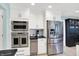 Well-equipped kitchen featuring stainless steel appliances, modern cabinetry, and ample storage space at 1219 Driftwood Dr, Carmel, IN 46033