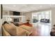 Inviting living room featuring a cozy fireplace, coffered ceilings, and an open layout with lots of light at 1219 Driftwood Dr, Carmel, IN 46033